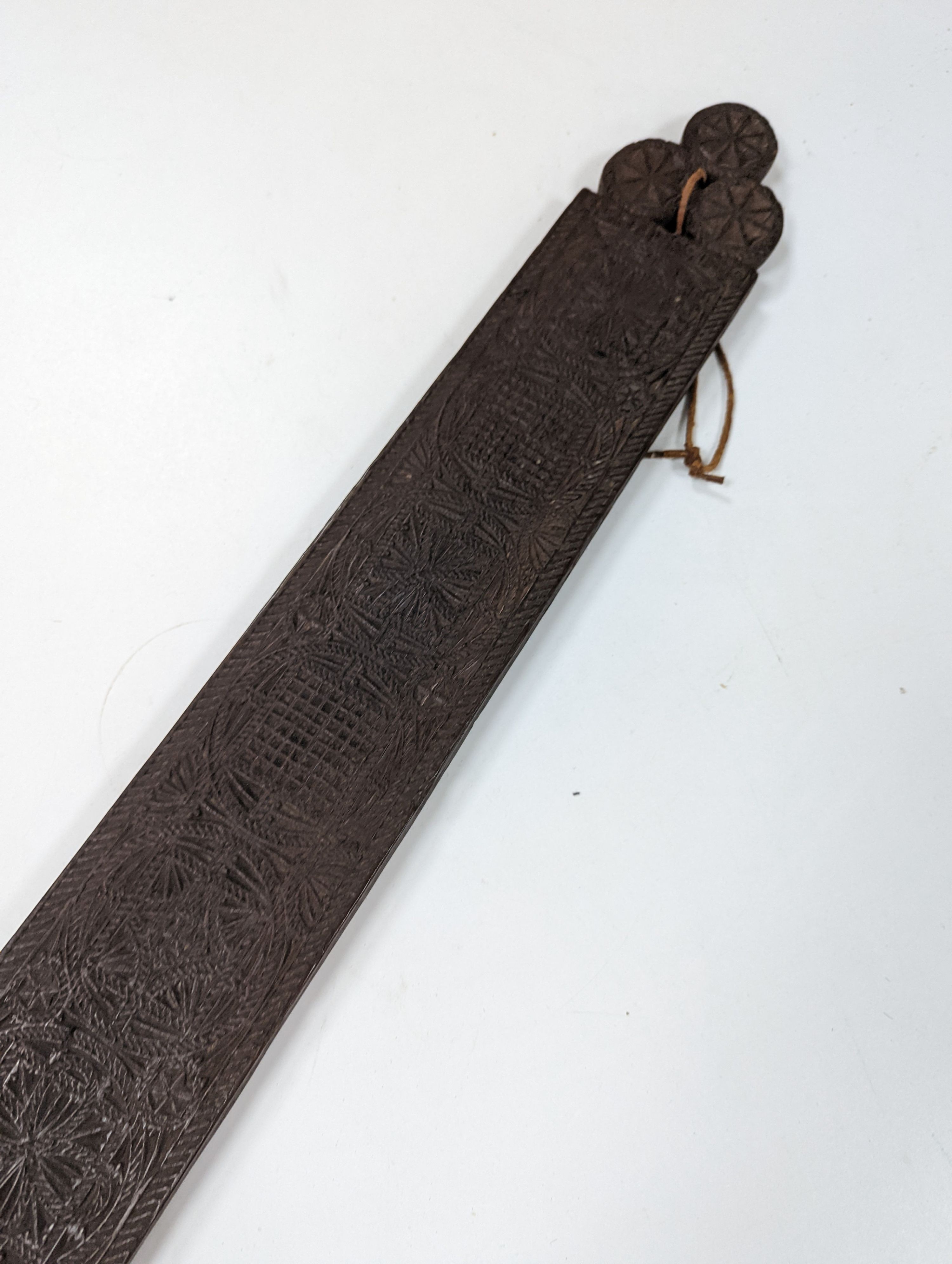 An 18th century Norwegian chip carved oak mangle board, dated 1730, 77cm
